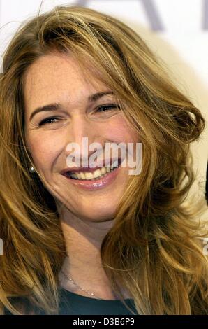 (dpa) - German tennis star Steffi Graf smiles during the presentation of her new handbag collection in Frankfurt, 16 August 2002. The collection 'Stefanie Graf Bag Collection' is produced by leather goods manufacturer Goldpfeil. Graf had the idea of her own bag collection as she is travelling a lot  Stock Photo