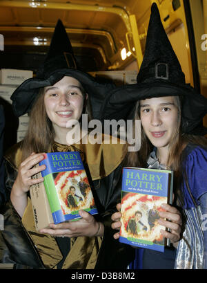 In the early morning Nadine (L) and Saskia of the Harry Potter Fan Club  hold the original English version of 'Harry Potter and the Half-Blood  Prince' in their hands in Berlin, Saturday