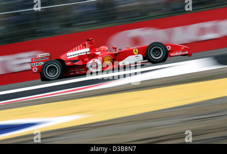 (dpa) - German Formula One driver Michael Schumacher of Ferrari is pictured in action during the practice session at the Silverstone circuit. UK, Saturday, 09 July 2005. The British Grand Prix will take place at the Silverstone circuit on Sunday, 10 July. Schumacher clocked the 7th fastest time at t Stock Photo