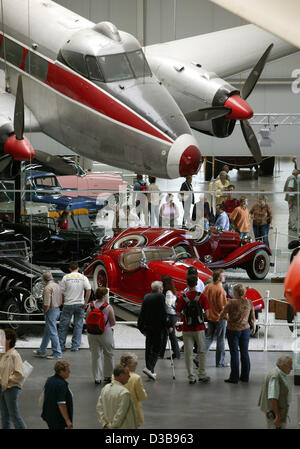 (dpa) - The picture shows visitors at the Automobile and Technology Museum in Sinsheim, Germany, Wednesday, 6 July 2005. More than 3,000 objects are on display in the exhibition hall covering 30,000 sqm. The outdoor area features the supersonic plane Concorde and a Russian Tupolev 144. The museum is Stock Photo