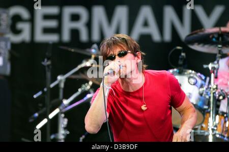 (dpa) - Morten Harket, singer of Norwegian pop group AHA, performs during the Live 8 Concert in Berlin, Germany, 02 July 2005. The concert, held simultaneously in many cities around the world including Paris, London, Philadelphia and Moscow, is intended to call attention to world poverty ahead of ne Stock Photo