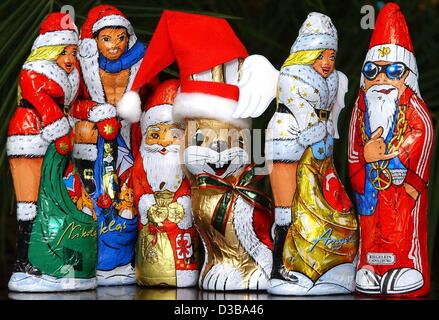 (dpa) - A collection of unusual chocolate santa clauses is shown in Duesseldorf, 29 October 2002, for example a female 'Claudine' with a very short cape, or a rapper in a red training suit. The chocolate producers intend to offer a greater variety of Christmas sweets. Stock Photo