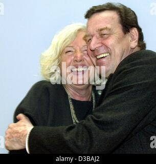 (dpa) - German Chancellor Gerhard Schroeder hugs Renate Schmidt ahead of a party meeting of the Social Democratic Party SPD in Berlin, 4 March 2002. The Chancellor on 16 October 2002 announced that Schmidt is to serve as Family Minister in the new parliamentary term. Schmidt had served as Chairwoman Stock Photo