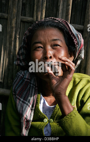 Tribal woman smoking cigar, Rangamati market, Chittagong Hill Tracts, Bangladesh, Asia Stock Photo