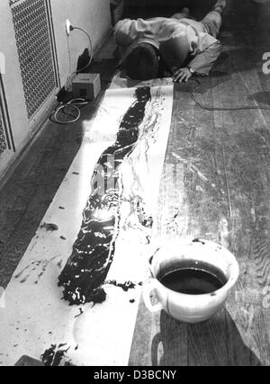 (dpa files) - South Korean artist Nam June Paik dips his head into a chamber pot filled with colour and then paints with his head on the paper banner on the floor, during a Fluxus event in Wiesbaden, West Germany, 1962. Paik, born on 20 July 1932 in Seoul, South Korea, moved to Germany in 1956 and b