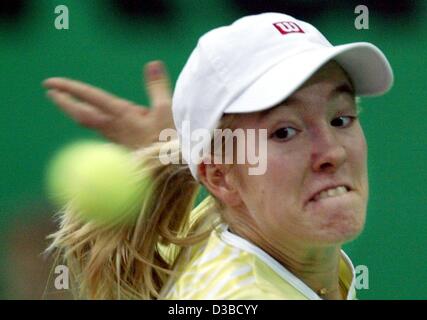 (dpa) - Belgium's Justine Henin returns a ball during the quarter final match of the 13th International Sparkassen Cup WTA Tournament in Leipzig, Germany, 27 September 2002. She defeats Slovakia's Daniela Hantuchova 6:4 and 7:5. Stock Photo
