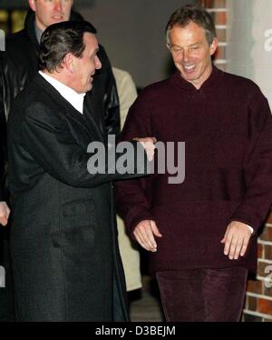 (dpa) - German Chancellor Gerhard Schroeder (L) and the British Prime Minister Tony Blair share a laugh in front of Schroeder's house in Hanover, Germany, 11 January 2003. Blair was on a private visit in Germany for the evening. Stock Photo