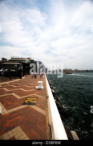 The quays at Circular Quay without ferries dock with darling harbor skyline. Stock Photo