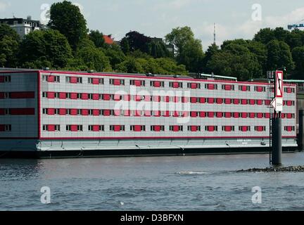 (dpa) - A view across the water towards a floating barge which functions as an accommodation for asylum seekers at the harbour in Hamburg, Germany, 6 June 2003. Stock Photo