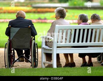 (dpa) - Four senior citizens sit on a bench in the castle gardens in Pillnitz, Germany, 27 May 2003. The about 19.5 million pensioners in Germany will this year only receive 1.04 per cent higher pensions in the western German states, and 1.19 per cent more in the eastern states, which at best just c Stock Photo