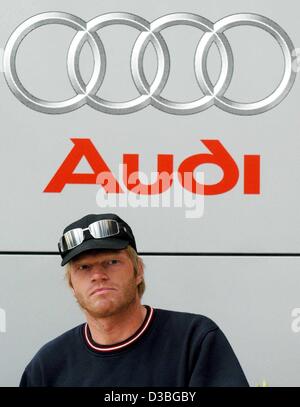 (dpa) - Keeper Oliver Kahn of FC Bayern Munich is pictured in front of the Audi logo, Ingolstadt, Germany, 21 May 2003. The car builder is sponsoring the top German soccer team and the players just received new cars. Stock Photo