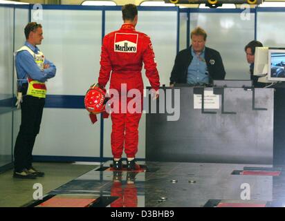 (dpa) - German formula one champion Michael Schumacher of Ferrari is being weighed after the free training for the Austrian grand prix on the A1-Ring racetrack in Spielberg, Austria, 16 May 2003. Stock Photo