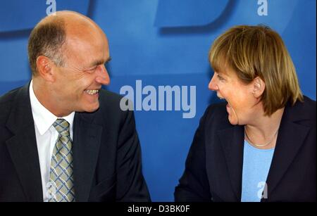 (dpa) - Angela Merkel, Chairwoman of the German opposition party CDU (Christian Democratic Union), shares a laugh with CDU General Secretary Laurenz Meyer in Berlin, 28 April 2003. Stock Photo