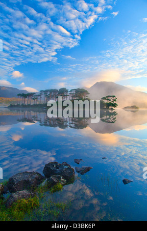 Misty morning reflection of the Twelve Bens in Derryclare Lough, Connemara, County Galway, Ireland. Stock Photo