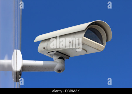 white CCTV camera under blue sky Stock Photo