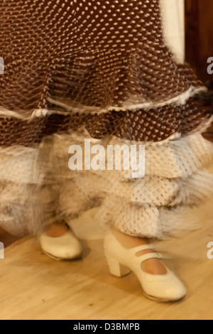 Flamenco dance with ruffled brown suit and white polka dots Stock Photo