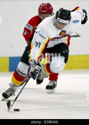 (dpa) - German national ice hockey player Sven Felski is in action during a game in Berlin, 23 April 2003. Germany wins the friendly game against Belarus 1-0. Stock Photo