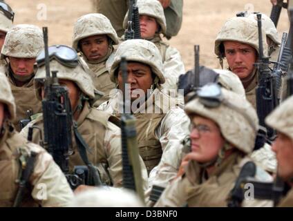 (dpa) - US Marines of the 3rd Light Amoured Reconnaissance Battalion (3rd LAR) mourn as they learn that a comrade of their battalion died in battle in Thamir, a suburb of Baghdad, Iraq, 7 April 2003. According to US figures, 80 American and 28 British soldiers lost their lives in the war, the BBC re Stock Photo
