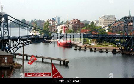 (dpa) - A view of the Kaiser Wilhelm (Emperor Wilhelm) Bridge in Wilhelmshaven, northern Germany, 30 June 2003. The bridge was built from 1905 to 1907 and is today the landmark sign of the city. It was designed by Ernst Troschel as the biggest swing bridge in Europe. Stock Photo