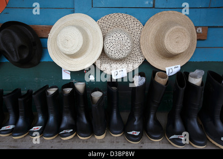 Hats and boots for sale, small shop in the town of Rio Sereno, Panama Stock Photo