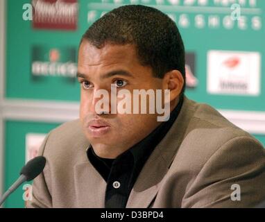 (dpa) - The Brazilian player Ailton of the German Bundesliga club SV Werder Bremen takes a deep breath during a press conference in Bremen, Germany, 9 October 2003. Ailton will next season play for the first division club FC Schalke 04, it was confirmed Tuesday evening, 7 October 2003. Ailton, who i Stock Photo
