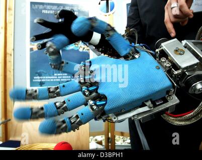 (dpa) - A gripper in the shape of a human hand is presented at the Humanoids 2003 conference in Karlsruhe, Germany, 1 October 2003. The gripper is controlled via a synchronized data glove. Stock Photo