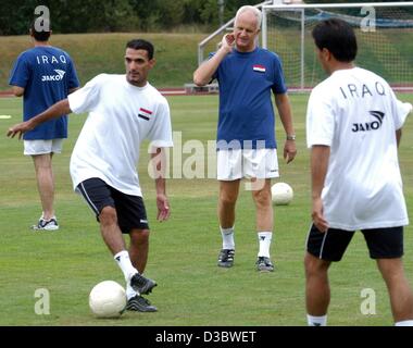 (dpa) - The German coach of the Iraqi national soccer team, Bernd Stange (C), watches his players during a practise at their training camp in Bad Woerishofen, Germany, 29 August 2003. The Iraqi team will train for the world championships in 2006 until 13 September 2003 in Bad Woerishofen, Bavaria. Stock Photo
