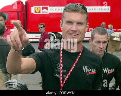 (dpa) - Scottish formula one pilot David Coulthard of McLaren-Mercedes gestures at the Hungaroring race track in Budapest, Hungary, 21 August 2003. The 13th run of the world championships, the Grand Prix of Hungary, will take place on 24 August.