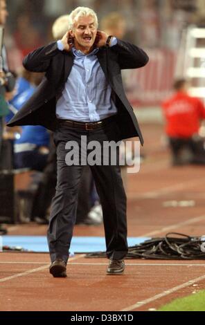 (dpa) - German national soccer coach Rudi Voeller gestures annoyed after his team missed a goal during the soccer friendly between Germany and Italy in Stuttgart, Germany, 20 August 2003. Italy wins 1-0. Stock Photo