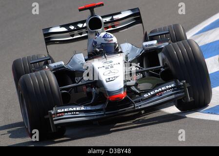 (dpa) - Scottish formula one pilot David Coulthard (McLaren-Mercedes) steers his bolide through a curve during the free training on the Hockenheimring race track in Hockenheim, Germany, 1 August 2003. He finishes with the best time. The 12th run of the world championships, the Grand Prix of Germany,