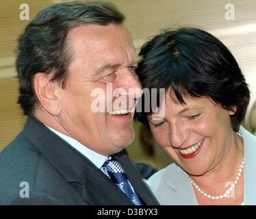 (dpa) - German Chancellor Gerhard Schroeder and German Health Minister Ulla Schmidt are all smiles after the negotiations for the healthcare reform between the government and the oppositional parties in Berlin, 21 July 2003. The agreement reached on 21 July 2003 after two weeks of negotiations forse Stock Photo