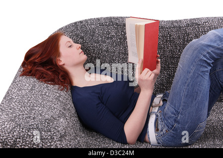 woman relaxing with book on couch Stock Photo