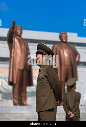 Soldiers In Front Of The Two Statues Of The Dear Leaders In Grand Monument Of Mansu Hill, Pyongyang, North Korea Stock Photo