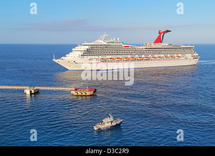 Cruise ship Carnival Triumph docking at the international cruise terminal in Cozumel Mexico Stock Photo