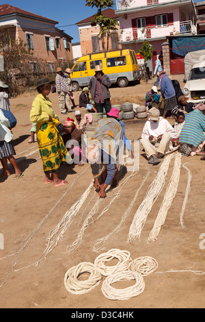 Madagascar, Ambositra, Marche Sandrandahy market, customers at sisal rope stall Stock Photo