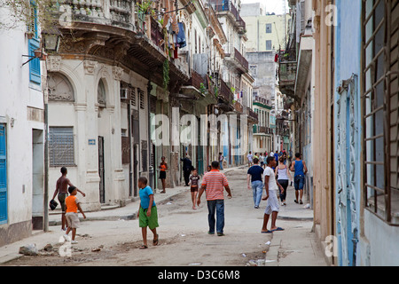 Youngsters in dilapidated street in Old Havana / La Habana Vieja, Cuba, Caribbean Stock Photo