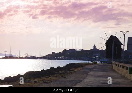 Bulgaria, Europe, Black Sea, Nessebar, Harbor, Seaport, Historical Windmill On The Isthmus At Sunset. Stock Photo