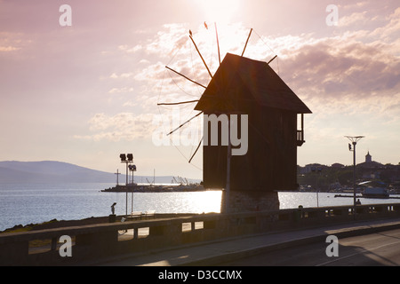 Bulgaria, Europe, Black Sea, Nessebar, Harbor, Seaport, Historical Wooden Windmill On The Isthmus, Sunrise. Stock Photo