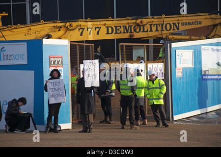 Bournemouth, UK 15 February 2013. The bulldozers start tearing down the glass front of one of the most hated buildings in the UK, the Imax complex building on Bournemouth seafront. Once demolished, the site will be turned into an open-air events arena, ready for the summer season. Stock Photo