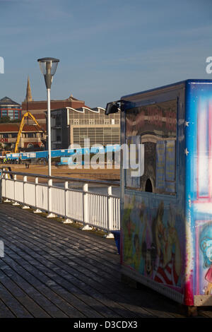 Bournemouth, UK 15 February 2013. The bulldozers start tearing down the glass front of one of the most hated buildings in the UK, the Imax complex building on Bournemouth seafront. Once demolished, the site will be turned into an open-air events arena, ready for the summer season. Stock Photo