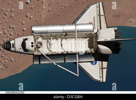 Space Shuttle Discovery Over Earth (NASA, International Space Station, 03/07/11) Stock Photo