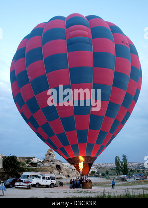 Hot air balloons being inflated to fly over Cappadocia (Kapadokya), Nevsehir Province, Turkey, listed as a World Heritage Site. Stock Photo