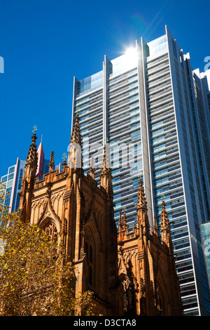 St. Andrew's Anglican Cathedral with modern office building in background Town Hall Square Sydney Australia Stock Photo