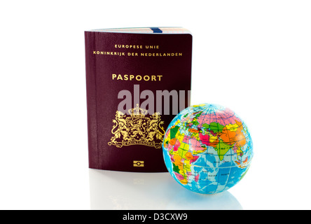 dutch passport travel document with world globe Stock Photo