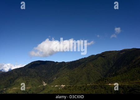 Mountain road,blasted out of the rock not very far from Yotong La,3400m. Amazing view of the Bhutanese landscape,36MPX,HI-RES Stock Photo