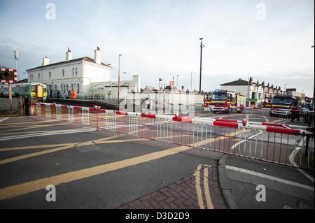 Brighton, Sussex, UK. Saturday 16th February 2013. A man was hit by a train at Portslade station. Eye witness reports say that a man in his 30s tried to cross the track at the station and was pinned by a train which was just leaving the station. Emergency services attend the scene. Credit: Darren Cool/Alamy Live News Stock Photo