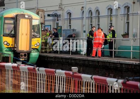 Brighton, Sussex, UK. Saturday 16th February 2013. A man was hit by a train at Portslade station. Eye witness reports say that a man in his 30s tried to cross the track at the station and was pinned by a train which was just leaving the station. Emergency services attend the scene. Credit: Darren Cool/Alamy Live News Stock Photo