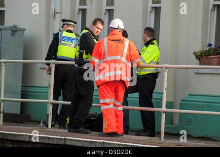 Brighton, Sussex, UK. Saturday 16th February 2013. A man was hit by a train at Portslade station. Eye witness reports say that a man in his 30s tried to cross the track at the station and was pinned by a train which was just leaving the station. Emergency services attend the scene. Credit: Darren Cool/Alamy Live News Stock Photo