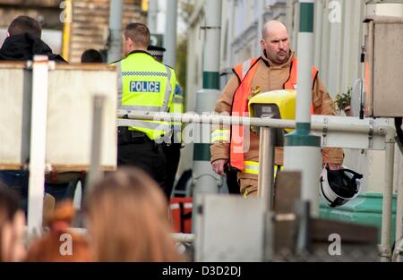 Brighton, Sussex, UK. Saturday 16th February 2013. A man was hit by a train at Portslade station. Eye witness reports say that a man in his 30s tried to cross the track at the station and was pinned by a train which was just leaving the station. Emergency services attend the scene. Credit: Darren Cool/Alamy Live News Stock Photo