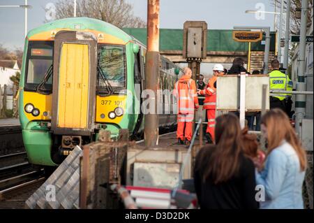 Brighton, Sussex, UK. Saturday 16th February 2013. A man was hit by a train at Portslade station. Eye witness reports say that a man in his 30s tried to cross the track at the station and was pinned by a train which was just leaving the station. Emergency services attend the scene. Credit: Darren Cool/Alamy Live News Stock Photo